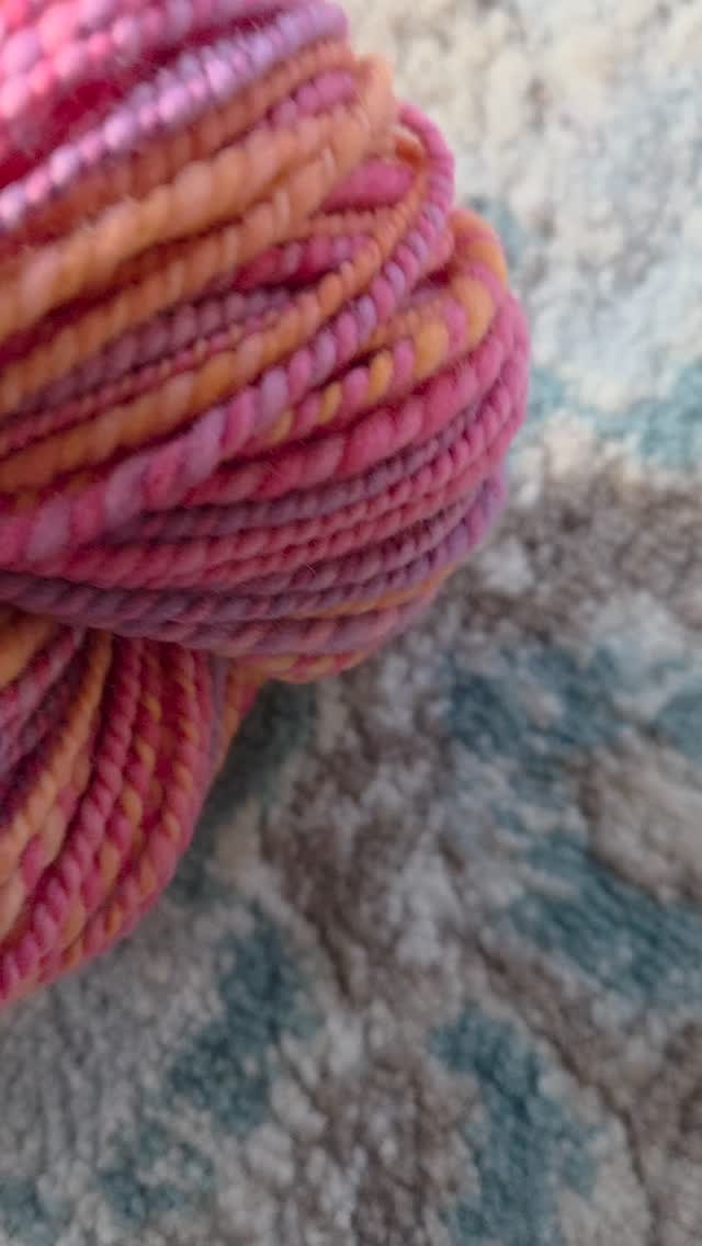 Sunrise - 172 yards of worsted weight merino wool in pink, orange, and purple.
#sunriselodgefiberstudio #spinnersofinstagram #handspunyarn #handdyed #handspun