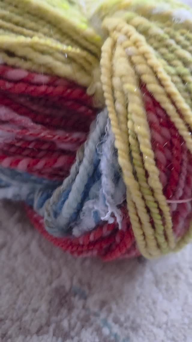 Rainbow Clouds - 216 yards of hand dyed merino wool blended with silver Angelina sparkle and recycled bottles for some fun fluffy texture.
#sunriselodgefiberstudio #spinnersofinstagram #handmade #handspunyarn #recycledyarn