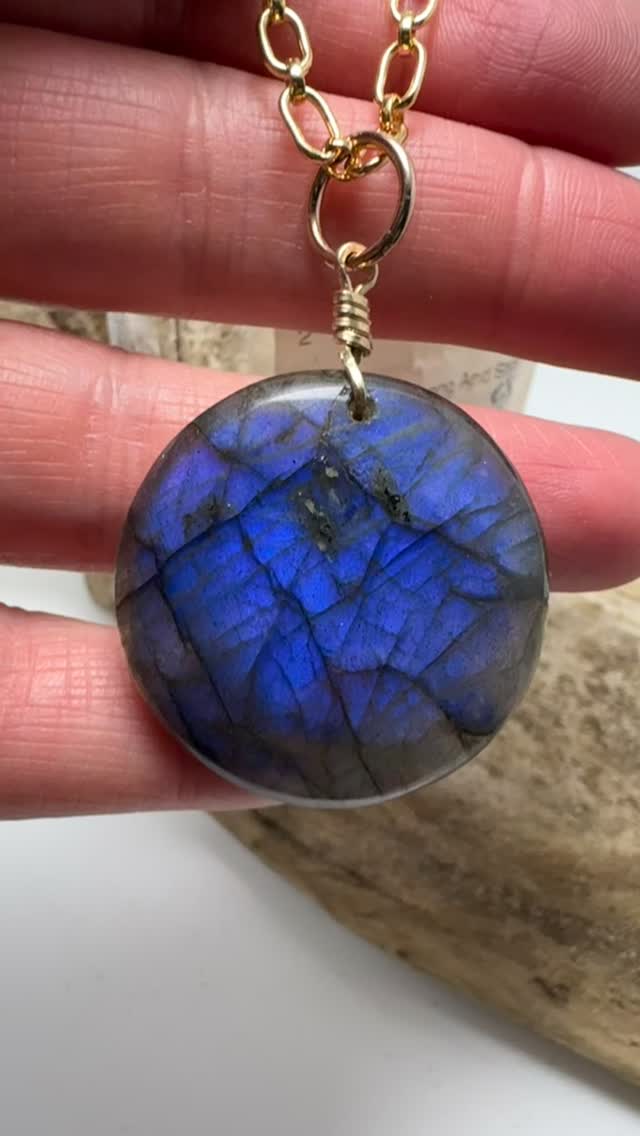 Beautiful labradorite with an uncommon violet flash that won’t quit! Crafted on a 14 kt gold-filled bail and thick chain