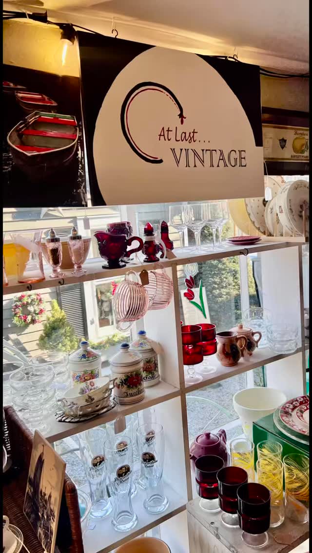 At Last Vintage’s Booth on the Tomato Factory porch is packed with the kind of pieces you don’t see every day.
A classic American Family Scale, a beautifully hand-painted floral metal tray, green enamelware buckets with honest wear, and shelves full of vintage bowls, platters, crocks, pitchers, and glassware. There’s milk glass, ironstone, pressed glass, character pieces, and plenty of small finds that are both useful and good looking.
It’s an easy mix of kitchen staples and display pieces—nothing trendy, nothing overdone, just solid vintage with real age and charm.
And when you’re done on the porch, step inside and visit their two other booths along with 20+ other dealers throughout the Tomato Factory—each space filled with its own mix of antiques, vintage finds, art, and home décor.