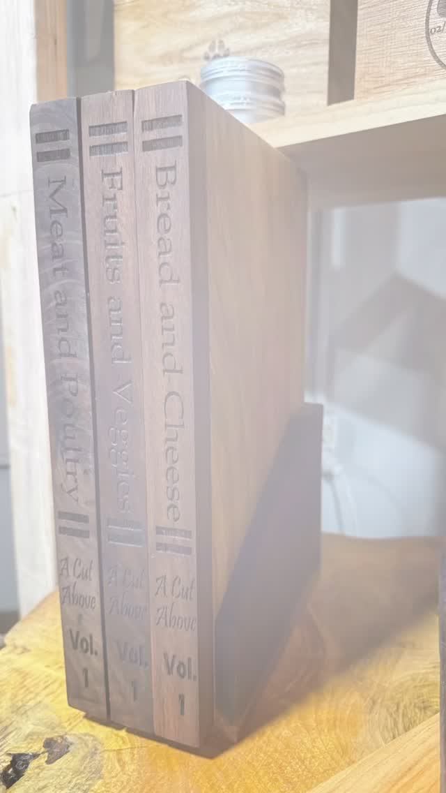 A few months back a friend of ours sent us a video of “recipe book” cutting boards, so you know we had to do em’ better than everyone else. Introducing: Vol. 1 - Ash & walnut, fully functional “recipe book” cutting boards. Handcrafted and illustrated by A Cut Above! #fyp #customwoodworking #asmr #smallbusiness #customwoodwork #customcuttingboard#ashwood #walnutwood #customart#handmade #woodworker #molineillinois #tagthequadcities