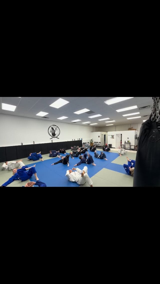 A BJJ class is foreign to most, the most common question we get is what does a class consist of.
1) we do a team warmup, usually consisting of Jiu Jitsu specific movements, movement challenge.
2) The class instructor demonstrates techniques, which you then drill with your partner (new students are paired with a senior member or coach).
3) we finish class by ‘rolling’ meaning we do timed rounds of grappling, allowing the application of the learned techniques, changing partner after each round (new students are paired with experienced members or coaches to help them ease into the process).
Sweat, Laugh, Learn to Kick Ass, Repeat.
Go to our website to book a free week trial.
