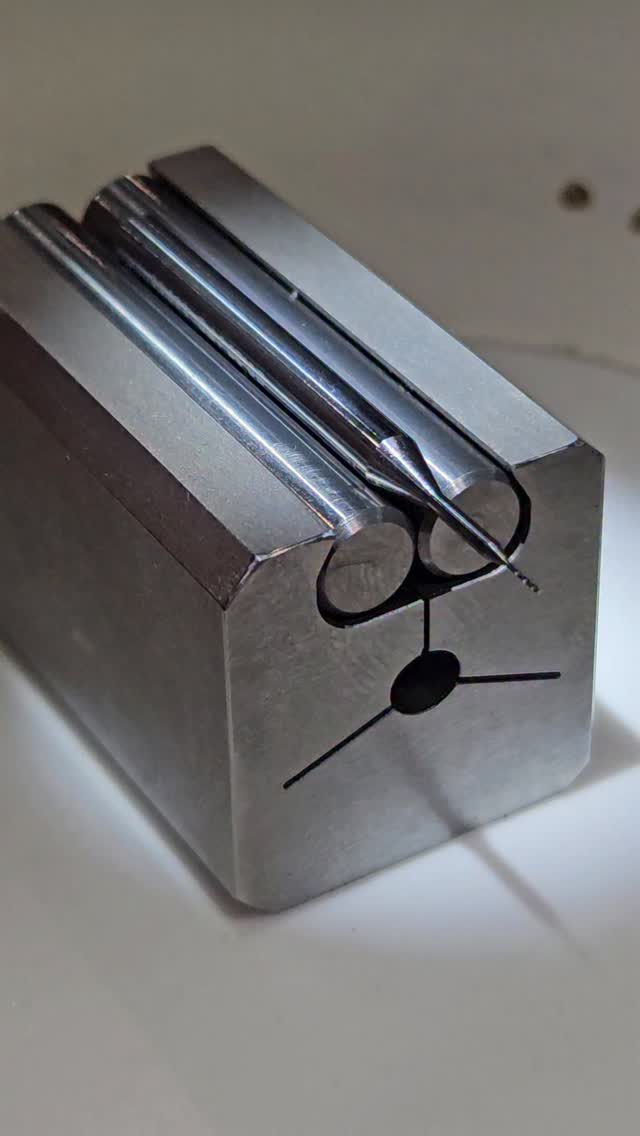 Shop-made vee block. Carbide pins provide hard-wearing surfaces, they are preloaded by the flexure, which able to be cammed open (the central bore is an oval), so if the pins ever wear, it's easy to either just rotate them, or replace them.
The carbide pins are used/old @nstool_intl 6mm shanked endmills, and are cylindrical within 2um. Great starting points for precision projects. good job Jack. Another apprentice project knocked out of the park.