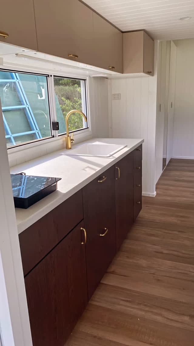 Loving how this one is coming together.
The rich dark cabinetry paired with warm brass accents gives this tiny home such a timeless, elevated feel. It’s cozy, a little moody, and still feels bright and spacious, proof that small spaces can have big personality.
This new tiny home is almost ready, and we’re a bit obsessed with the details. If you’d like to come and have a look in person, get in touch, we’d love to show you around.
#gruaustralia #tinyhouse #tinyhouseaustralia #tinyliving #affordableliving #modularhome #modularliving