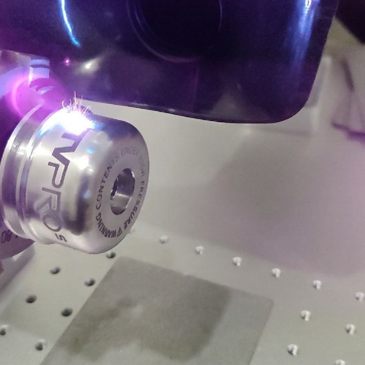 Using the new laser engraver on some sweet shock caps for UTV Pros.