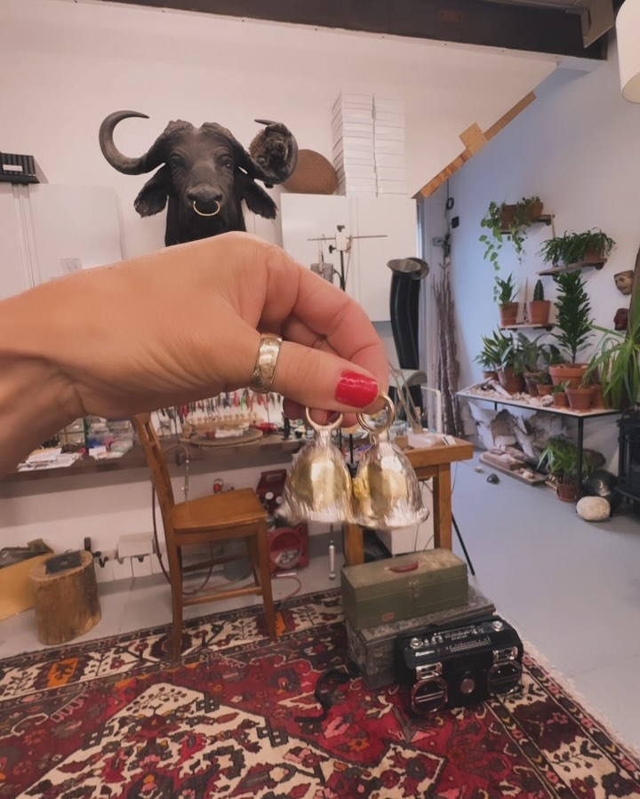 People sometimes ask me what I actually do in my business and work. And as I’ve gone along it’s changed to a large part of it being custom pieces made just for the person that have spun off an idea or style that I’ve made before or it’s a new style that we come up with together.✨
These pieces were a spin on the guardian bells I’ve been making for a while. Eric builds custom motorcycles in our shop and with this came the beautiful legend of the guardian bell. Guardian bells are a gift that one gives to a loved one to protect them on the road when out for a ride.
Here’s how the bell works: legend has it that there are harmful spirits that lurk on the roadways, always on the lookout for motorcycles to cling onto and cause mischief. You may have heard of unusual and hard-to-diagnose problems that occur in machines (most often in electrical systems) being called “gremlins,” and supposedly, it is these same unpredictable and harmful spirits that cause problems for motorcycles and their riders.
The Guardian Bell is a way to ward off these spirits. It is said to work by capturing them in the hollow of the bell and infuriating them with the constant ringing until they release their hold and break free, returning to the roadway to find another unsuspecting rider without a bell to harass instead.
Making these to be given as gifts before an epic Harley cross country adventure was so much fun. They’re made of hand casted sterling silver bells with gold bails, knockers and plaques carved with a nod to the Harley logo. Each custom engraved with the riders name as a final touch of good luck ✨🏍️ 🤘🏽#guardianbells#motocycle#motobikes#harleydavidson