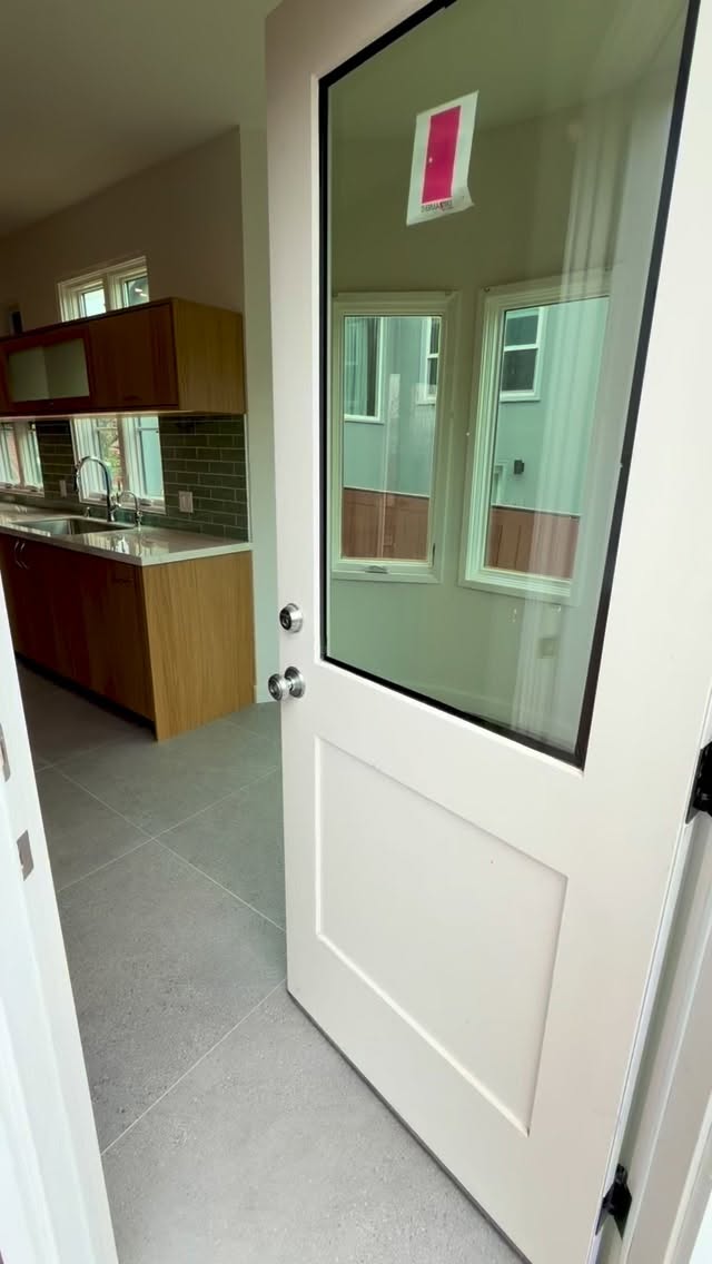 Clean lines. Warm wood tones. Soft sage backsplash. Stainless steel finishes.
This space was redesigned for simplicity, function, and timeless appeal. Natural wood cabinetry adds warmth, while the light quartz countertops and subway tile bring balance and brightness.