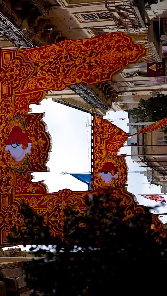 Valletta’s red feast banners drape the streets in vibrant tradition.