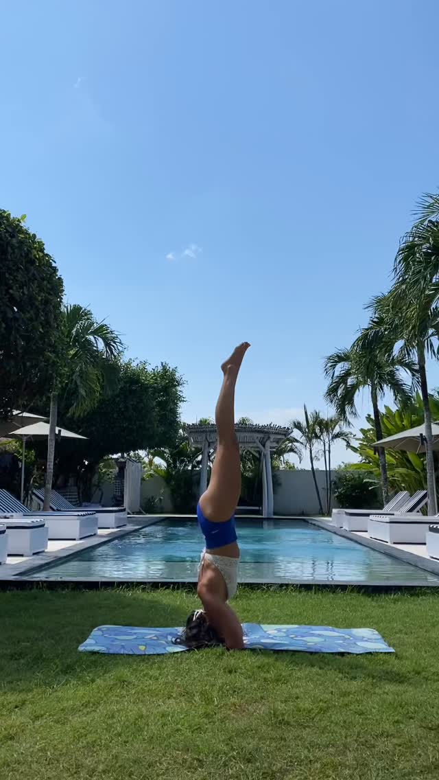 Our guest doing yoga on a garden by the pool. White Palm Eco-Chic Hotel is a quiet and calm place where you can rest and meditate