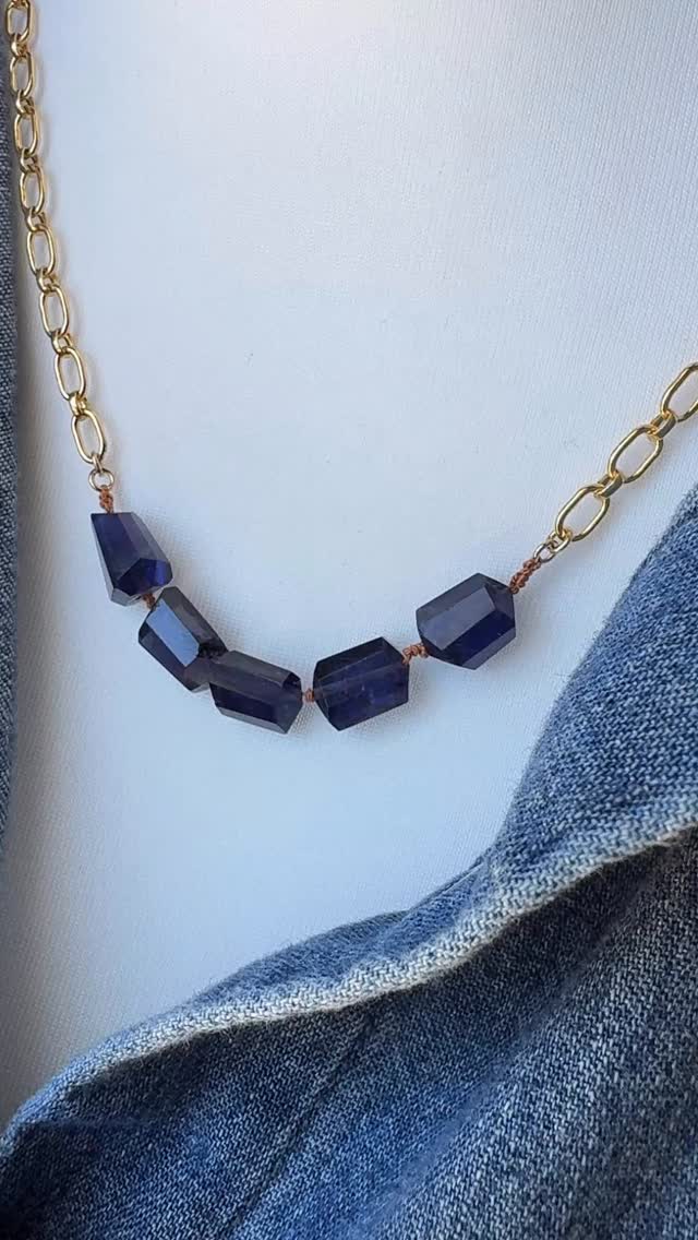 Iolite hand knotted on silk cord centered on 14kt gold-fill adjustable chain. Iolite is a blue-violet stone with some flecks of pyrite; think a deep denim color. The irregular shape of each stone and the beautiful facets highlight the beauty of the stone, and provides a bit of sparkle. This versatile necklace is perfect for layering.
Iolite is useful in meditation and is correlated with the third eye chakra: intuition, mental clarity, and emotional balance.
#handmadejewelry #iolitejewelry #milwaukeejeweler