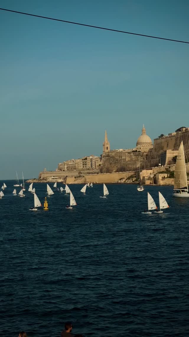 Whispers of wind carry boats through Mediterranean blue.