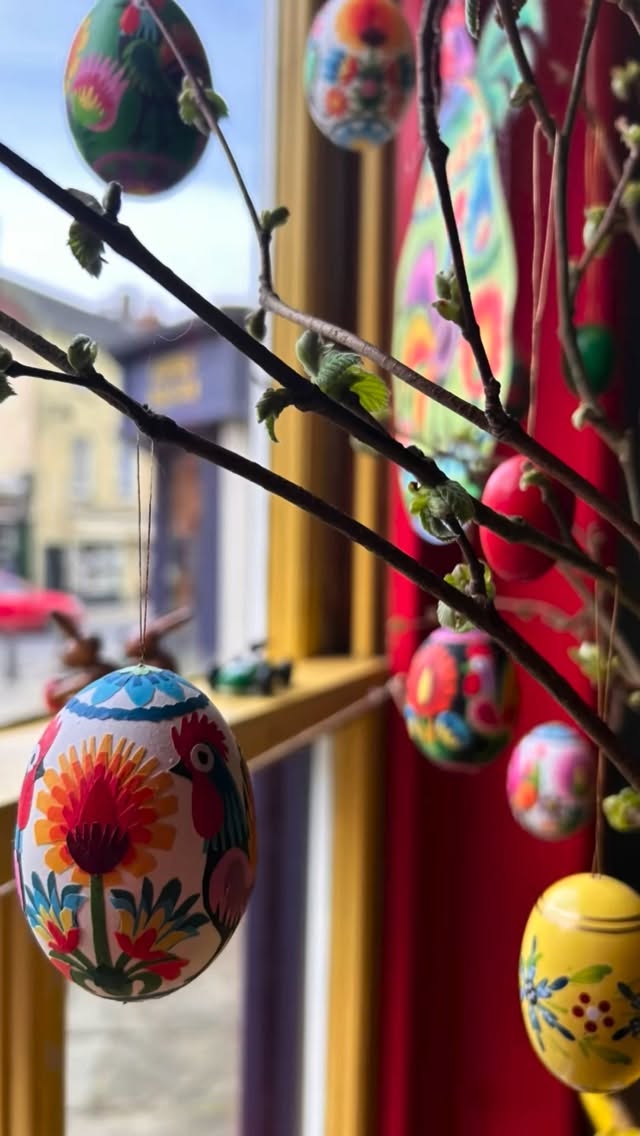 Twirling Polish wycinanki eggs.
These are typical of the Lowicz area. The papercut collage on each one has been painstakingly applied by hand to real, blown painted eggs by renowned Polish folk artist Maria Ciechańska.
Wycinanki, pronounced “vee-chee-non-kee”, is the folk art of papercutting. Traditional wycinanki designs feature repetitive motifs and symmetrical compositions. People originally cut coloured paper with sheep shears (!) and without the aid of a stencil or pencil drew and created beautiful collages to decorate their homes adorning white-washed interior walls and ceiling rafters. The most common designs are spruce trees and flowers or feature animals, particularly birds like chickens and roosters. Other designs, called gwiazdy, are geometric, including circles, stars, snowflakes, and other shapes.
Well, there you have it. Come and fill your baskets ( carefully). Each egg is £15 and they’re twirling away in my shop and available on my website ( SHOP THE EDIT or DECORATION pages).