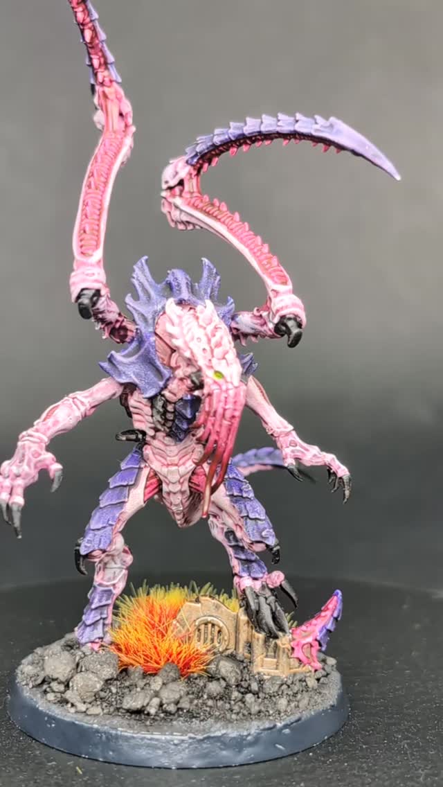 We're advancing 40,000 years with this next guy doing a twirl for you all. I felt like I needed to get some more sci-fi under my acrylic belt, and this freak drew me right in. I think the general aesthetic of the tyranids are synonymous with 40k, at least to the uninitiated like myself. I'm not usually one for box art paint schemes, but I really wanted to try my hand at the purple and pink and I think he came out pretty great. But not pretty. Because that is a face that even an alien freak mother couldn't love. Especially the sound that I imagine he makes when he eats. Slurping up his morning cereal with a lack of self awareness and extra dose of ignorance on the side