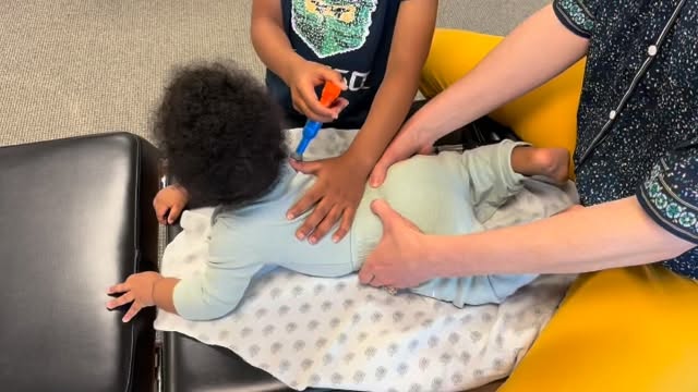 Assisting Dr. Katrina with her adjustment on baby brother.
Schedule an appointment for you and your whole family with Dr. Katrina today at Triada Chiropractic!
>>> triadachiropractic.janeapp.com