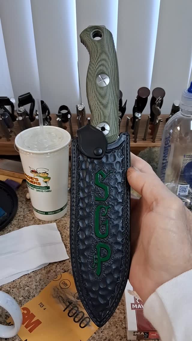 Really cool handle bar mount knife sheath for a return customer. Hand tooled hammered look with custom retainer. #knife #sheath #motorcycle #biker #bikerlife