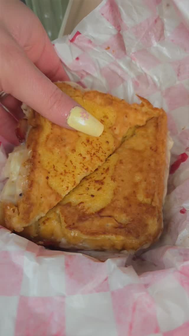 Our Bacon French Toast Grilled Cheese. This was sent to us by a customer at our last event. Look at that cheese pull! #grilledcheese #breakfastclub #tacomafoodtrucks #thetinystackshack