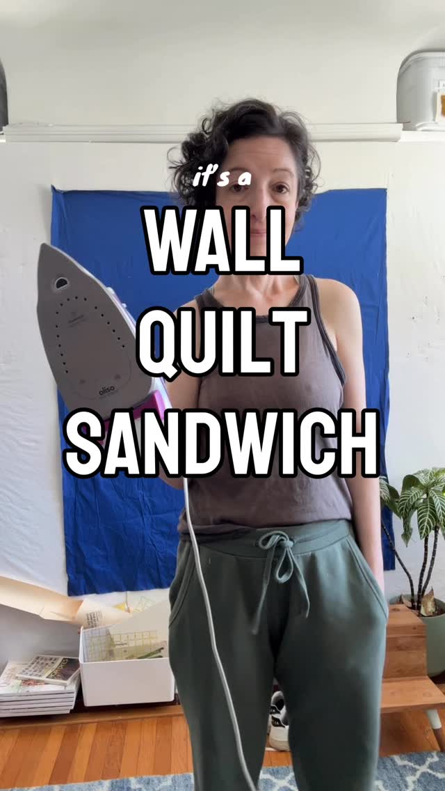 I’m a pretty big fan of making my quilt sandwich on the wall. Partially because I have a small space and I’d have to move my dining room table if I wanted to even have floor space to do it.
Sometimes I’ll use my cutting table, but it’s not that big either. With the wall you get gravity helping out… kind of. You do have to be careful you don’t pin your quilt to your design wall though…