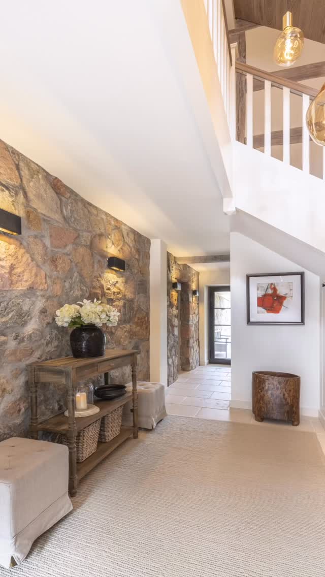 Warm, grounded, and welcoming - this entrance area blends natural stone, soft textiles, and warm lighting into a calm first impression.
Rough stone walls meet clean white architecture, while wood and woven elements add texture and depth. Subtle lighting highlights the materials and guides the space with a quiet, atmospheric glow.
A transition space designed to slow you down the moment you arrive.
#interiordesign #entryway #warmminimalism #naturalmaterials #timelessdesign