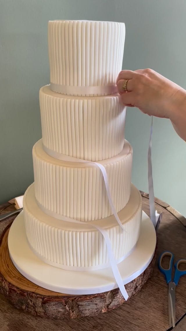 There’s something truly special about the final moments before a wedding begins… ✨
This weekend we had the pleasure of setting up one of our wedding cakes at @towerhillbarns , carefully bringing every detail together on-site. From placing each tier to adding the final decorative touches, it’s always a magical process watching the cake come to life in its setting.
What starts as a design in our studio is transformed into a stunning centrepiece, perfectly styled to complement the venue and the couple’s vision. Seeing it all come together — surrounded by flowers, décor, and that unmistakable wedding atmosphere — never gets old.
Moments like these remind us why we love what we do 💕
#weddingcake #weddingcakedesign #towerhillbarns #northwalesweddings #weddinginspiration
