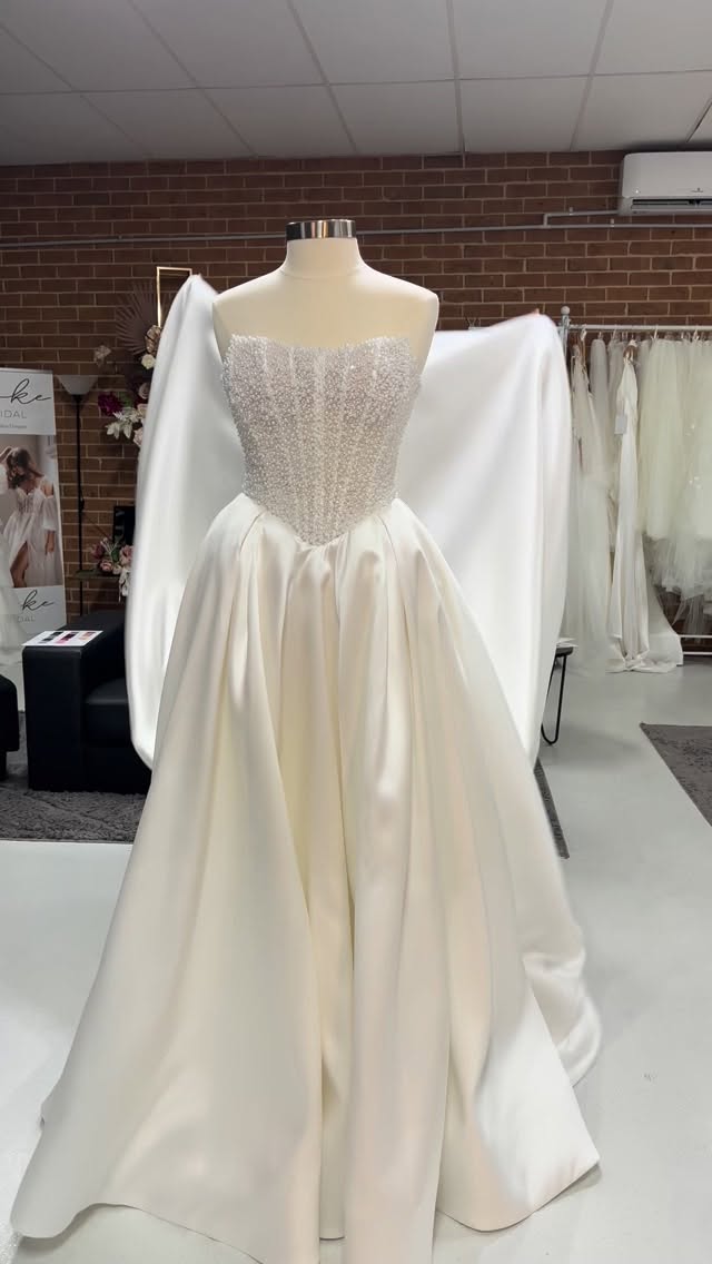 Lottie is a pearl beaded basque waist corset bodice with a voluminous mikado skirt.
The dress is manageable and exciting while wearing it.
We can’t wait to see the first brides fall in love with her 😍
#bridalgowns #dreamweddingdress #sayyestothedress #centralcoastnsw