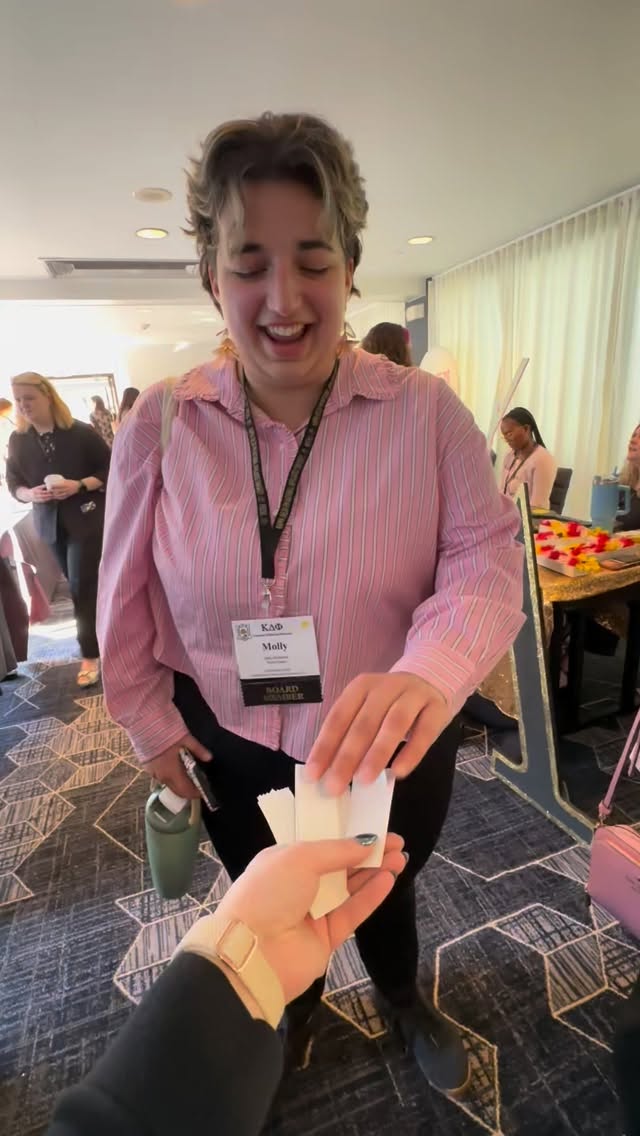 Shake hands with a sister… but make it KappaCon26 💛🖤