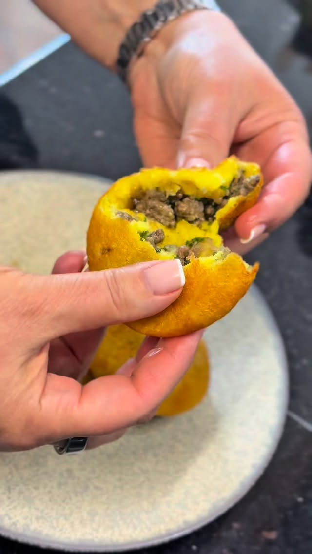 Potato Chap ⬇️⬇️⬇️ RECIPE BELOW - Potato Kubba/patties
Makes: 25 pieces
Shell
• 1 kg boiled potatoes
• 1 egg, beaten
• 150 g potato starch
• 1 tbsp salt
• 1 tsp turmeric powder
Filling
• 450 g minced meat
• 150 g finely chopped onions
• 1 tsp salt
• 1 tsp pepper
• 2 tbsp 7 spice
• 40 g chopped parsley
• 2 tbsp oil
Boil the potatoes until tender. Peel and mash using a potato press or masher. Add salt and turmeric. Beat the egg and mix it in. Dissolve the potato starch in 150 ml of cold water and add it to the potatoes. Mix until you get a smooth, creamy dough.
In a frying pan, heat the oil and sauté the minced meat. When half browned, add the onions. Cook until fully browned, then stir in salt, pepper, and 7 spice. Let the mixture cool, then mix in the chopped parsley.
Lightly oil your hands. Take 60 g of the potato mixture, flatten it in your palm, and create a well. Fill with a spoonful of meat mixture, seal it shut, and shape into a ball. Flatten slightly to form a patty
Heat oil in a deep frying pan or skillet over medium heat
Carefully place the assembled patties into the hot oil, ensuring not to overcrowd the pan.
Fry each patty for about 3-4 minutes on each side, or until they turn golden brown and crispy.
Once fried, transfer the patties to a plate lined with paper towels to absorb any excess oil.
Serve the potato chap warm as an appetizer or alongside your main course. They pair well with a side of fresh salad or a dipping sauce of your choice.
Enjoy your delicious homemade Potato Chap!#iraqifood #iraqiflavors #foodlover #potatorecipes #yummy