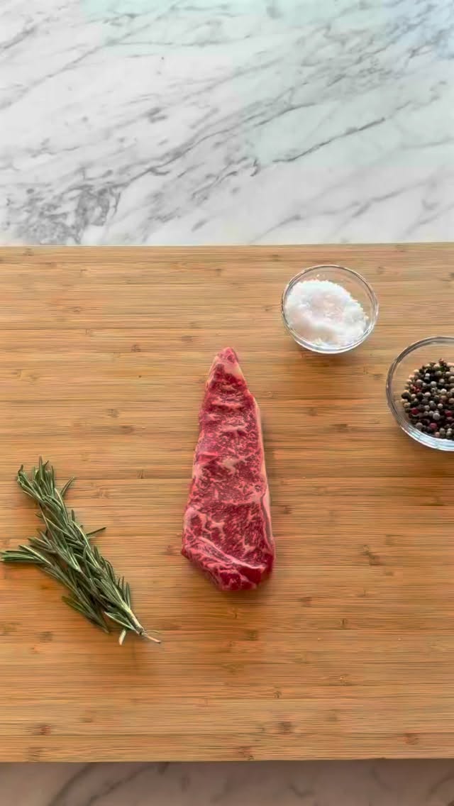 We’re gonna show you in 30 seconds how easy and fast it is to cook one of our New Hampshire strip steaks!
All you’re gonna do is salt and pepper both sides generously. Seriously, this is the only seasoning you want on this!
Melt some butter in a skillet. Using butter instead of oil will enhance that rich Wagyu flavor! When the butter is melted, add your steak. Cook for a minute or two, depending how done you like your steak. You can always use an instant read thermometer here.
Flip, and sear for another minute or two. Transfer to a plate and let it rest for 5-10 minutes to let the juices redistribute within the steak for maximum tenderness and flavor.
And just like that, it’s ready to eat! It’s really that easy, and so delicious. 🥩
#wagyusteak #easyrecipe #cookwithme