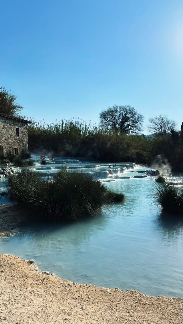 The Water: Ancient, Alive, Extraordinary:
Every drop of water that surfaces at Saturnia has been on a journey of forty years, travelling slowly and silently through underground geological formations, gathering minerals, dissolving stone, and emerging at precisely the same temperature it has always reached: 37.5°C (99.5°F). There is something humbling about that constancy. The world above changes; the water does not.
The spring regenerates itself completely every four hours, ensuring the water you bathe in is perpetually fresh. It rises from a natural crater at a flow of approximately 500 litres every four hours, filling four thermal pools with waterfalls and whirlpools that shimmer — in every shade of blue, depending on the light — against the Tuscan sky. @cascatedelmulino_saturnia #cascatedelmulino #saturnia #terme #thermalwater #nature