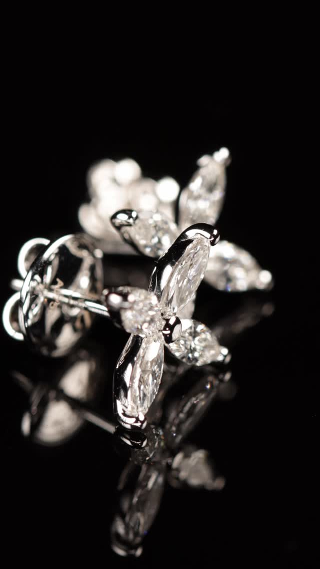 Four navette-cut diamonds arranged around a single point. The result looks like it grew that way.
The navette cut, also known as the marquise, is one of the oldest fancy cuts in diamond history. Its name comes from the French word for boat, a reference to the elongated hull shape that tapers to a point at both ends. A single navette diamond is already distinctive. Place four of them tip to tip around a central setting, each one angled outward like a petal, and the geometry produces something the eye does not immediately read as diamonds at all. It reads as a flower. A form that appears organic, natural, as though it was never designed but simply found.
Each earring carries four navette-cut diamonds in F-VS, 1.95 carats total across both, set in 18-carat white gold weighing 3.60 grams for the pair. The white gold disappears almost entirely at this scale, what remains is eight diamonds and the negative space between them, holding a shape that has no straight lines and no visible structure. Only four stones meeting at a point, and the light that moves through each one differently depending on the angle.
By private appointment only.
The BrandZ — A Luxury Experience.
#thebrandz