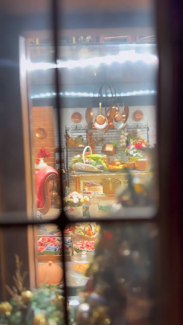 Here is a looksee inside the second floor of my cabinet house which is where I keep most of my kitchen and food miniatures ...be sure to say hi to HotManDoll back there ...yes, it's a bit chaotic right now, actually it often chaotic...it is maybe always actually. I straighten things up and organize but things start drifting out of place and I think I actually like it that way ...it's that process of putting things back in order, rearranging them and finding new places for them which is how I enjoy "playing" with miniatures. The cabinethouse is never really finished, it's always moving and shifting and changing depending on my mood, which miniatures! I may have recently #acuired and which ones I may have fallen out of love for which is very rare ...almost never or those that simply catch my eye that day. I think for me that disorder is part of the magic that I find in miniatures. Once everything is perfect, perfectly in place,I start looking for something new to move around again and I think my mind enjoys this process of creating order from chaos over and over again and honestly I wouldn't have it any other way #swoon #Dollhouse #DollhouseMiniature