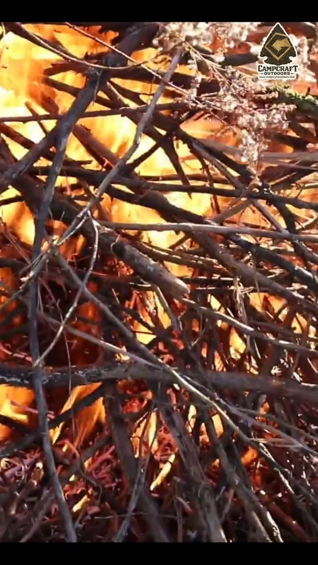 Need hot water but want to keep the fire going? Use a toggle! Tie a knot off-center on a stick, give yourself string, and scoot the fire back. Simple trick for safety. #campinghacks #outdoortips #survivalskills #firemanagement #DIY #outdoors #bushcraft #learnsomethingnew #ReelsTips