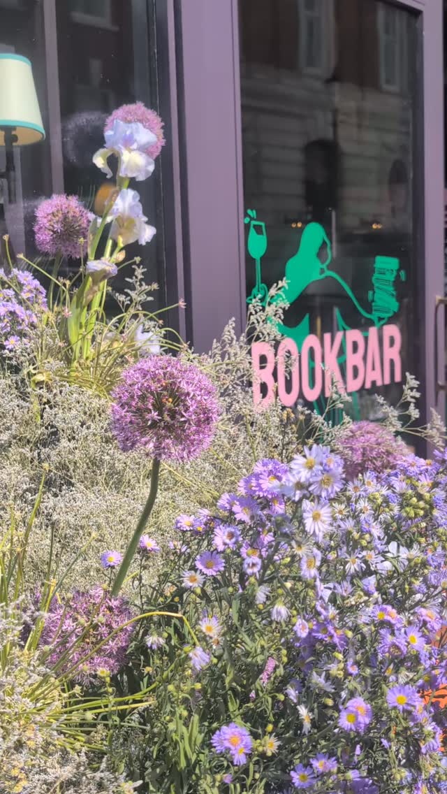 It's a long, sunny bank holiday weekend and the last weekend of Chelsea in Bloom so come on down to see our beautiful display, inspired by Aya Koda's beautiful book Tree and put together by @wild_renata_flowers in partnership with @penguinclassics 🌷☀️
We're open until 6pm tonight, from 10am-9pm tomorrow and from 11-6 on Sunday.
About the book and our display...
'Forest time is different from the time people keep … I wondered whether the forest moves slowly, or whether people’s lives are particularly fleeting.’ – Aya Koda, Tree
BookBar's iconic purple facade will be decorated in Aster clouds to create a surreal, dream-like design that mirrors the essence of Tree, and celebrates the wondrous beauty of the everyday. Tree is written in the zuihitsu form, meaning ‘follow the brush’, a genre of Japanese writing akin to the contemplative essay – and throughout the book we follow Aya Koda, as she journeys across Japan, in search of its most majestic trees. As with everything we do at BookBar, books are at the heart of our display and our goal as always is to bring people together through reading.
Pick up your copy of Tree, enjoy a glass of wine or a coffee and build you bank holiday reading piles. ☀️🌷📚☕🍷