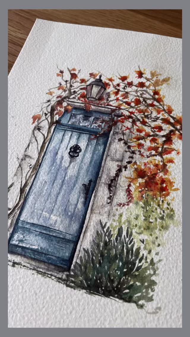 Happy Tuesday, everyone! This charming little door reminds me of Greece — the beautiful blue doors, vibrant flowers adorning the buildings, and the unmistakable Mediterranean charm. #paintingvideo #doorart #watercolourart #ukartist #wildfeatheredu