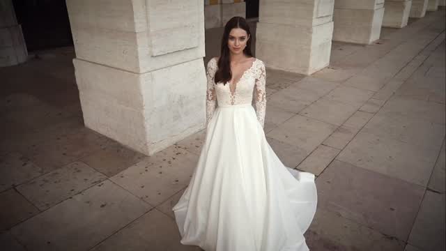 Stand out in this elegant gown. Featuring a V-back, plunging neckline, and long sleeves detailed with a delicate Chantilly lace. A bias belt compliments the natural waist and leads into a mikado A-line skirt. Scalloped eyelash lace details the neckline and cuffs while pockets add a modern touch.
@adorejustinalexander - Style 11149
#sleeves #bridalgown #weddingdress #hampshirebride #berkshirebride
