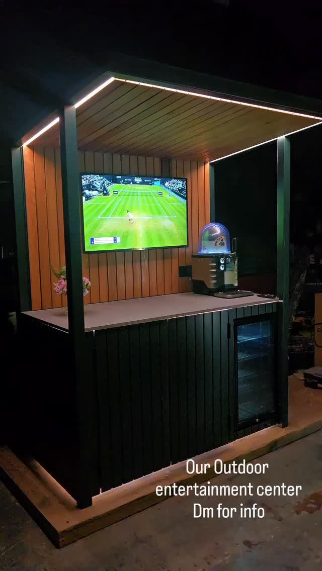 Premium Outdoor Garden Bar & Entertainment Unit – Bespoke Handmade
Transform your outdoor space with this stunning handcrafted garden bar and entertainment station. Built using premium materials and designed for modern gardens, this unit combines style, practicality, and luxury in one impressive feature piece.
Features
✔ Contemporary slatted timber design
✔ Integrated TV mounting area
✔ Built-in wine/drinks fridge housing
✔ LED perimeter lighting included
✔ Spacious worktop for food prep and serving
✔ Hidden storage cupboards with soft-close doors
✔ Weather-resistant construction suitable for year-round outdoor use
✔ Handmade in the UK
Dimensions
Width: 1800mm
Depth: 900mm
Height: 2300mm
other sizes available
Perfect For
Outdoor entertaining
Garden bars
BBQ areas
Outdoor kitchens
Sports viewing parties
Luxury patio spaces
Customisation Available
We can manufacture to your exact requirements, including:
gas bbq or green egg
Paint colours
Timber finishes
Fridge options
TV sizes
Worktop materials
Additional storage
Power and lighting upgrades
Condition
Brand new, made to order.
Delivery
Nationwide delivery available. Please contact us with your postcode for an accurate delivery quotation.
Why Buy From Us?
We specialise in bespoke outdoor furniture and garden structures, creating high-quality handcrafted products designed to last. Every unit is built to order with attention to detail and premium craftsmanship.
Bring the ultimate outdoor entertainment experience to your garden with this eye-catching bespoke garden bar.
Search terms: Outdoor bar, garden bar, outdoor kitchen, TV wall, garden entertainment unit, patio bar, BBQ station, luxury garden furniture, wine fridge cabinet, garden room furniture, bespoke outdoor living.