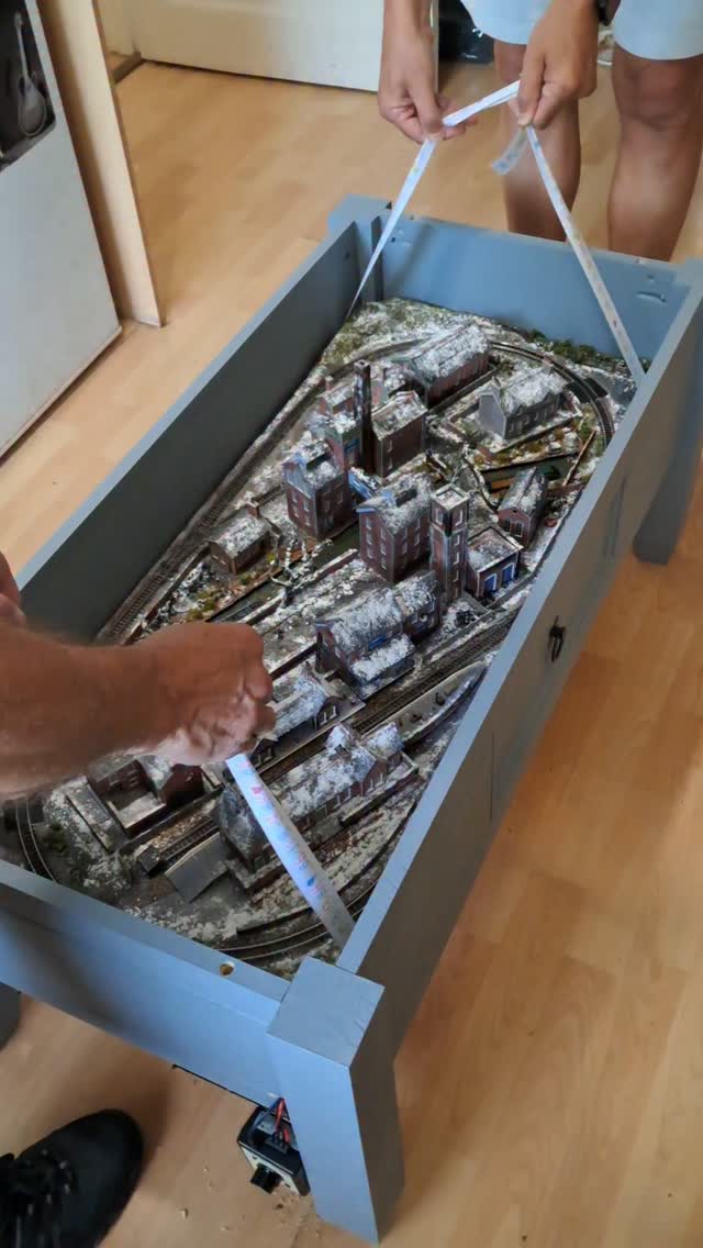 When you wimp out of lowering it in the table as younare sooo worried it wont fit !!
We were approached by our latest customer to see if we could make a coffee table layout loosely based on peaky blinders land !
Well we just had to have a go !!
With a snow theme and light up buildings. Safe to say we absolutely love it. ( and so does its owner ). This video.shows it with the tables glass top.
#peakyblinders #trainset #fblifestyle #mhhsbd