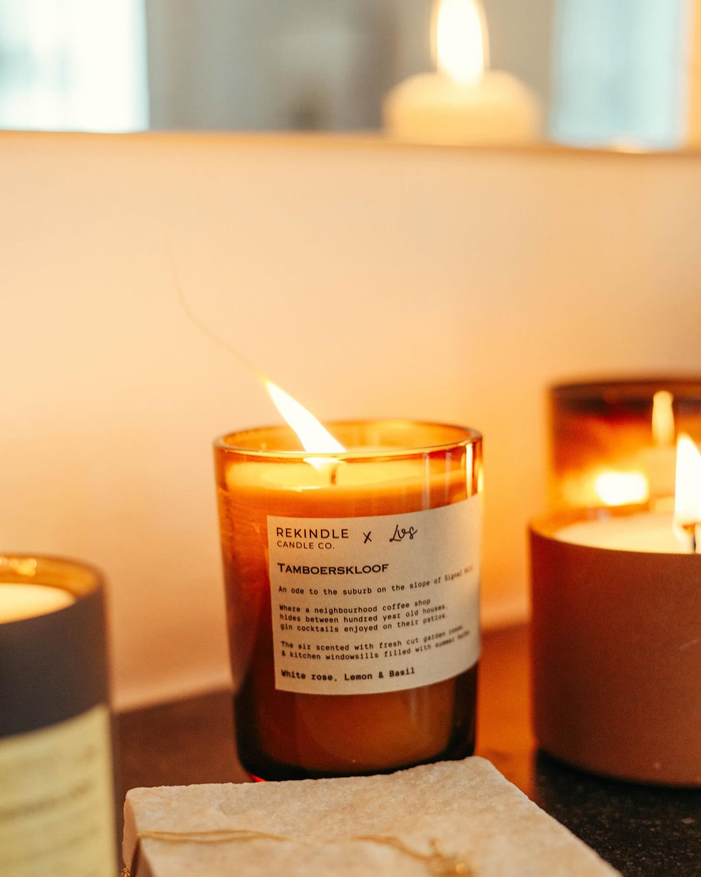 Officially introducing the latest addition to the Rekindle Signature Scent line: Tamboerskloof | White rose, lemon and basil. An ode to our own neighborhood.
Capturing the scent of the suburb that lies in the shade of signal hill. Where lemon trees are abundant, and garden roses climb over fences along the narrow streets. Window boxes filled with herbs, and neighbours who know each other by name.
The scent was inspired by and created with the lovely @lisevschoor and these magical images were shot in her iconic, and beautifully curated Tamboerskloof home.
Tambeorskloof is in stock across the full product range, now available at our online store. Xx
📸 by the brilliant @justincraythornephotography