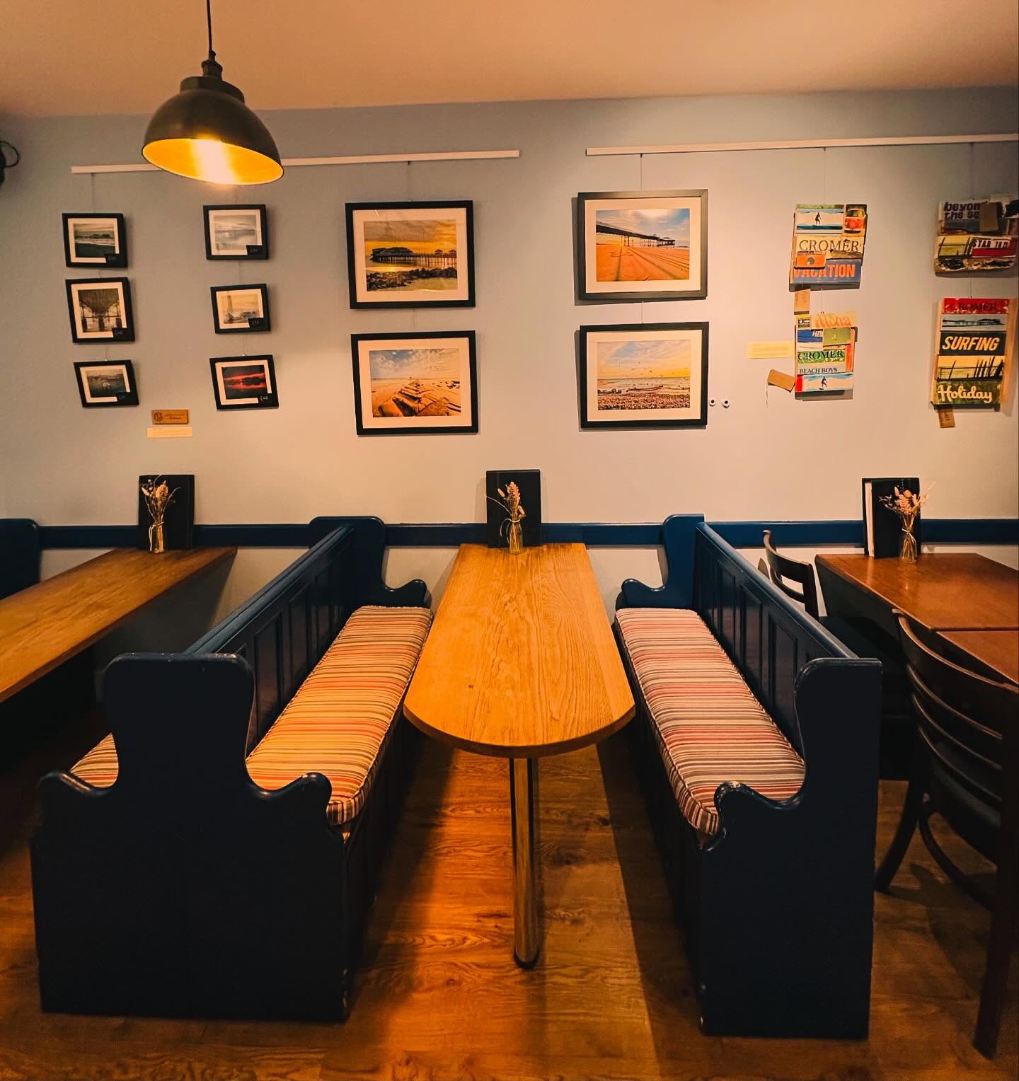 We’ve updated the artwork on display at The Bistro with work from two well known local artists which really help to brighten the place up now that we’re tiptoeing towards the clocks changing and darker evenings along with it!
@ania.moore.92 is a familiar face around the town and very talented with a camera. She has kindly provided us with four large shots taken on Cromer beach, printed and framed by Artyfax at the other end of town.
Already well know to many or our customers at The Bistro, having worked there for 13 years up to 2021, @rachel_grout has provided two framed prints of her new pen drawing Cromer maps, as well as three prints from a previous seasons work. We have Rachel’s postcards available to buy at £1.50 each and you can find more of her work available to purchase @thistleandtide , next to Jarrolds & this years limited edition run of Cromer themed Christmas cards will be available very soon!
Ania & Rachel’s work joins pieces already on display by @westwickforester , @tpg28 , @jacksondrawingswallart, @artyfaxcom, @rosiebradley.art and other provided by @gardenhousecromer including @samuelthomasart & Sheila Harvey!
#cromer #localart #localtalent #creativecromer