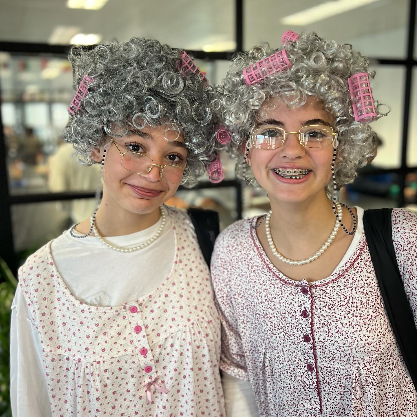 Curler rocking grannies showed up to school. Halloween must be near.