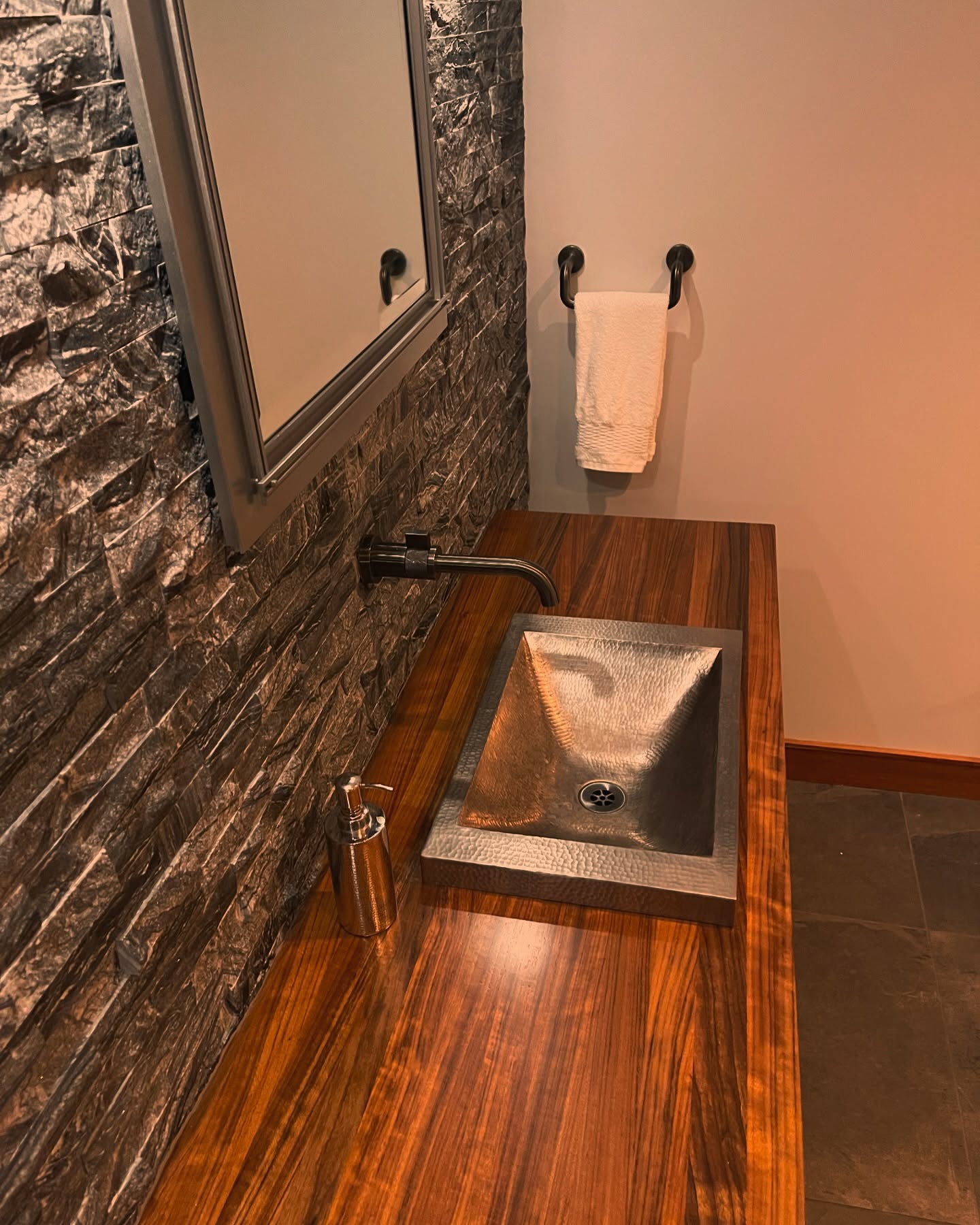 Peaceful and Serene Media Room Lavatory. #mediaroom #lavatory #stone #woodcountertop @grothouseinc #custom #archtecture #interiordesign #interiordesigner #architecture