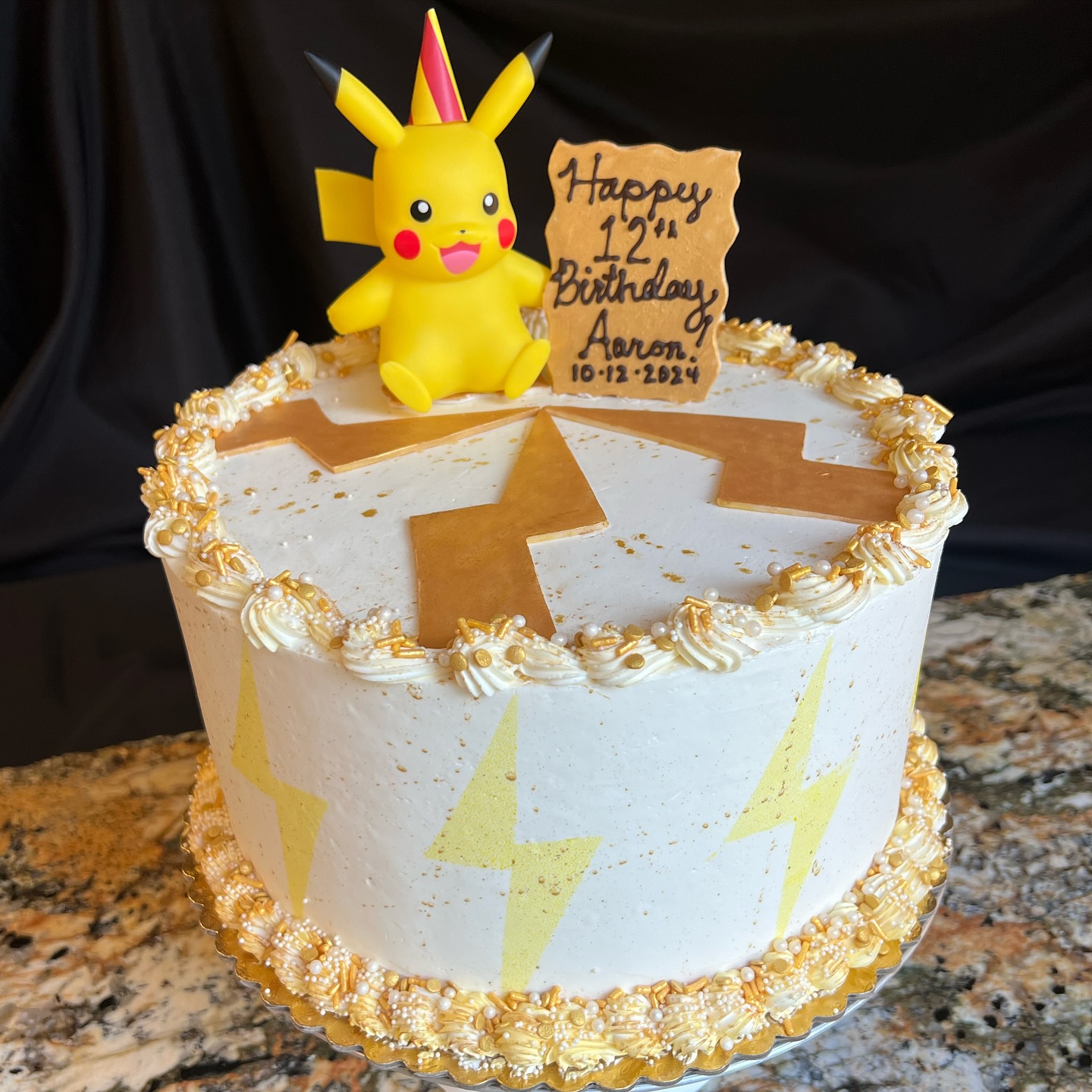 Happy Golden Birthday to Aaron! I had a BLAST making this Pikachu-themed 12th Golden Birthday Cake.
โจโก๏ธ๐โก๏ธโจ
For those who donโt know, a โGolden Birthdayโ is a once-in-a-lifetime moment when you turn the same age as the day you were born, so this was such a special cake to make!
โจโก๏ธ๐โก๏ธโจ
As the birthday boy requested, this cake is a Chocolate Cake ๐ซ with Espresso Buttercream Filling โ๏ธ and Vanilla Gold Buttercream exterior with a custom mix of gold sprinkles.
โจโก๏ธ๐โก๏ธโจ
9 Lightning Bolts โก๏ธ spark around this cake with an edible gold sign and 3 more handmade Lightning Bolts โก๏ธ made of White Chocolate surround a Pikachu Figurine in the middle (with his own party hat!) โก๏ธ
That makes a total of 12 lightning bolts for this 12th Birthday Cake enjoyed on October 12th. How cool is that?! โก๏ธ
PS - did you count how many lighting bolts were in this post?
โก๏ธ๐ฉโ๐ณโก๏ธ
#cake #birthday #goldenbirthday #pokemonbirthday #pokemon #pikachu #electricpokemon #bdaycake #sacramento #elkgrove #kidsbirthday #pkmn #customcake #custombirthdaycake #chocolate #whitechocolate #chocolatecake #pastrychef #pastrylife #sacramentobakery #goldenbirthdaycake #goldenbday #ordercustomcake #cakespaz #coffee @profhayes