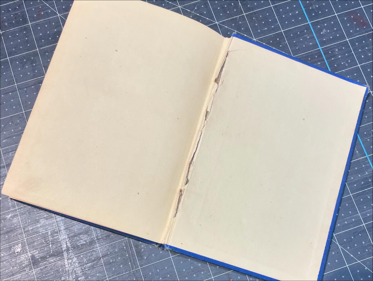 A little before and after, fixing a broken hinge. A little PVA, a little acrylic tissue toning, and we have a new secure hung to open and use the book again!
#bookbindingmaterials #bookbindersofinstagram #bookandpaperconservation #paperrepair #japanesetissuepaper #tonedtissue #colortheory101 #bookrepair