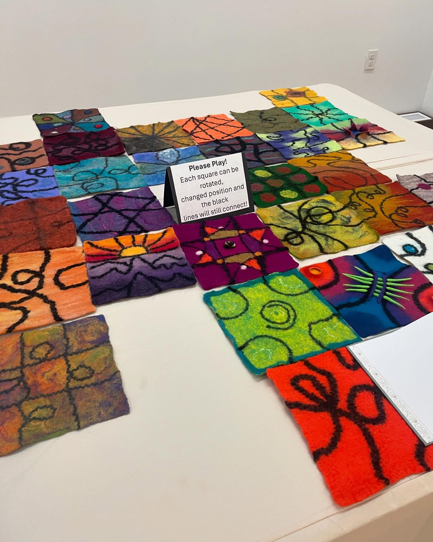 Please Play! Is a bonus feature at the Ribbon of Highway show in Basking Ridge, NJ. NEFG members created handmade felt squares with black yarn entering and exiting the squares at an exact measured location. This interactive exhibit allows visitors to move/rotate the squares, yet the pieces always remain connected.
As guild members, we are from all over, yet we always remain connected. ❤️
#northeastfeltmakersguild
#NEFG
#interactiveart
#interactiveexhibit
#collaborativeart
#collaborativeartproject
