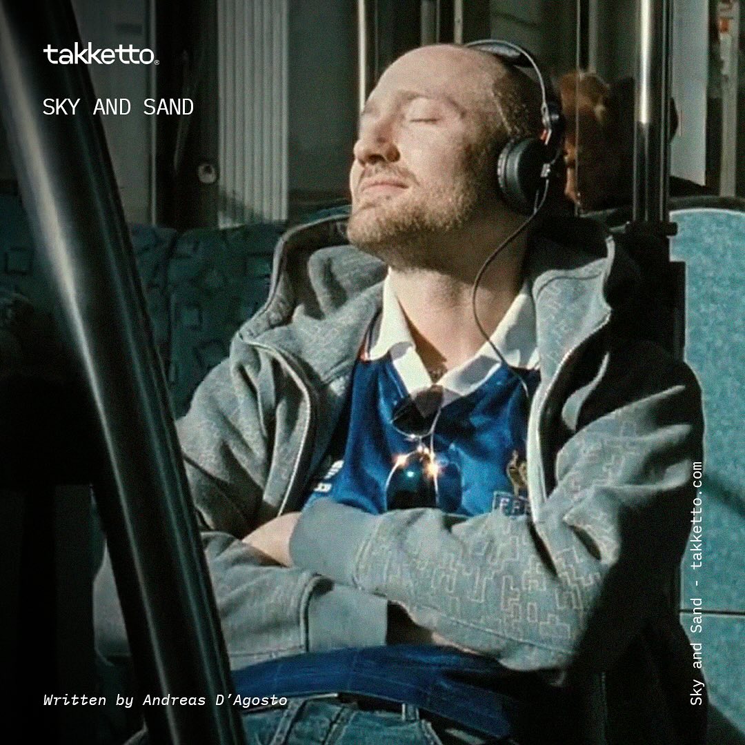 An enveloping melancholy resurfaces with every sweet and rhythmic note. The 90s generation made it their own, like a Game Boy session by the sea. Sky and Sand is the electronic anthem of a generation that turned clubbing into a mainstream phenomenon. Paul Kalkbrenner was a DJ known only in Berlin, where techno found its favorite home.
It was a visionary film that brought him to the wider public, a movie where he plays the lead and which faithfully depicts the reality of European clubbing. Berlin Calling quickly became a cult classic, and its eponymous soundtrack, a global success.
However, there’s a missing piece in this description, a detail that won’t go unnoticed by the most observant. Paul, playing the tormented and brilliant DJ Ickarus, wears throughout the film a series of original football jerseys that don’t belong to his collection.
In the first scene, the DJ wears Argentina’s jersey, the one that enchanted Zenga and made our country weep. Later, as he performs across Europe, he dons Platini’s number 10 from 1982 and a replica of the stunning white jersey of West Germany from 1958.
Then comes the first Italian relic: AC Milan’s 1990-91 jersey with the Champions Cup badge. Ickarus returns to perform dressed in Cologne’s 1983-84 jersey, paired with Milan’s 1993 jacket. In the hospital, the DJ sports a replica of Moore’s red jersey from the 1966 World Cup victory.
At the peak of his emotional turmoil, he chooses Uruguay’s 1982 jersey and a replica of the Netherlands’ shirt signed by Cruyff. His rebirth is marked by a replica of Portugal’s jersey with a green diagonal stripe and another from Brazil’s 1962 team, evoking the great Garrincha.
Ultimately, Berlin Calling was ahead of its time, solidifying the connection between football fashion and the underground lifestyle—a relationship that has now become immensely popular.
Written by Andreas D’Agosto @5tar3oy
#PaulKalkbrenner #techno #acmilan #footballhistory #art #footballart #takketto