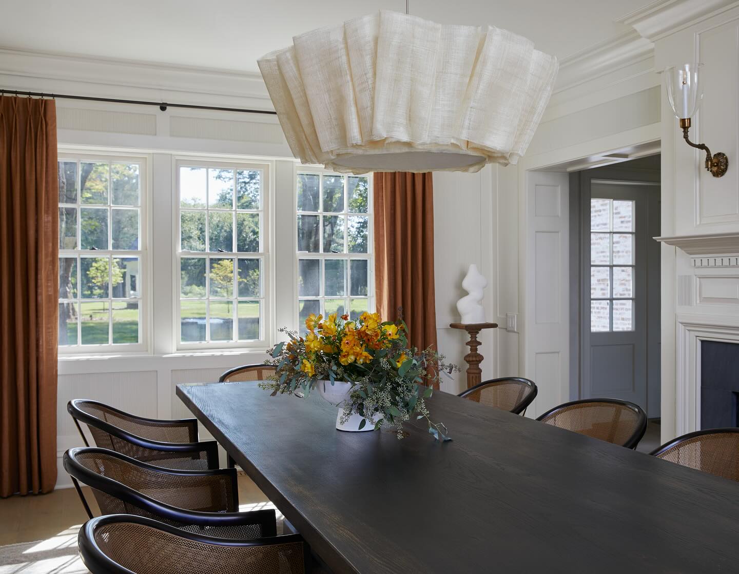 Time to prep those tablescapes! I love envisioning these rooms full of food and family. I can’t believe we haven’t really ever shared this dining room from Avondale. It’s nestled between rooms on the same floor with dramatic walls and ceilings so it’s more of a subtle textural palette cleanse, ready to take to linens, flatware and florals for any season - though personally those glazed ginger drapes are feeling very apropos for tomorrow’s big day 🍁
*Fun fact: this is where I really fell for reeded millwork details. Though it’s become a bigger and bigger trend we found it on the salvaged fireplace surround that was original to the house! We brought that detail through to the paneled walls, drenched in the perfect creamy white. Swipe to see ✨
Photo: @eastandlane
Build: @dewsoncc
Architect: Charles Goebel