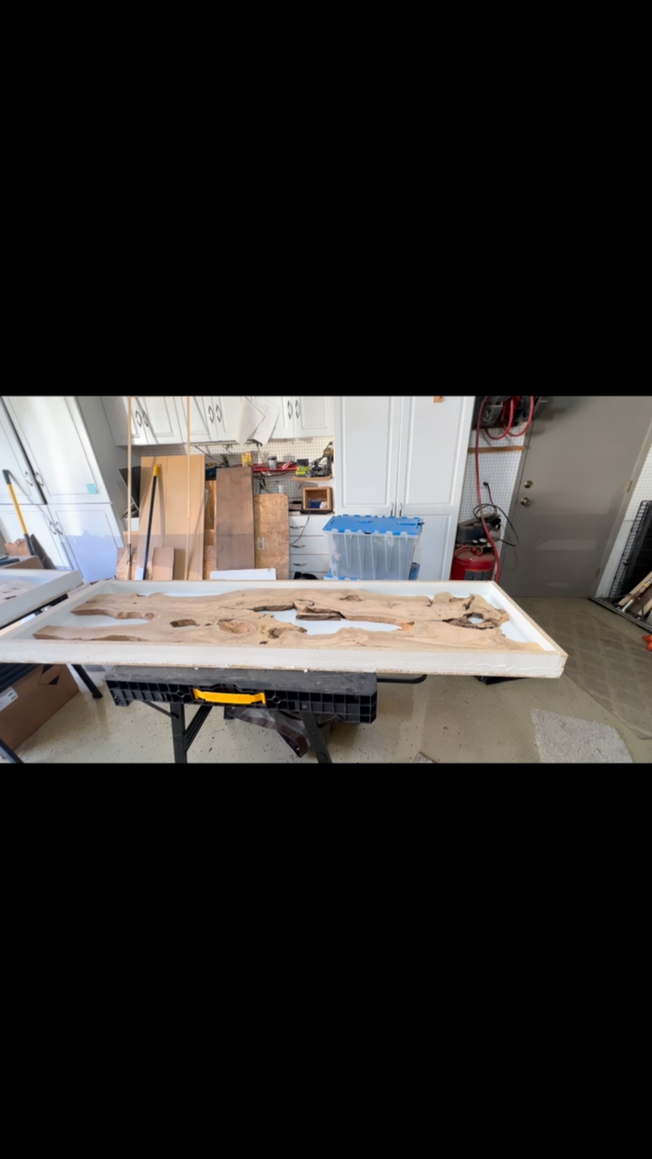 The two 18 inch deep by 5 and 6 feet long live edge olive and resin benches ready for the pour.
