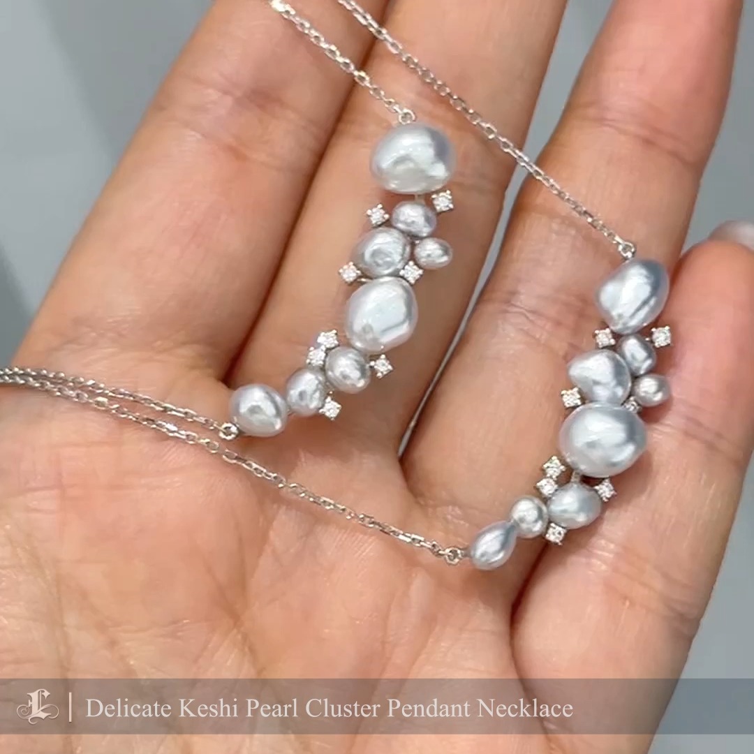 This refined necklace features a cluster of lustrous Keshi pearls in silvery tones, accented by sparkling diamonds for a subtle touch of brilliance. Set on a sleek white gold chain, its minimalist design highlights the pearls' organic beauty. Perfect for both casual and formal occasions, this piece exudes effortless elegance.
#keshipearlpendant #keshipearljewellery