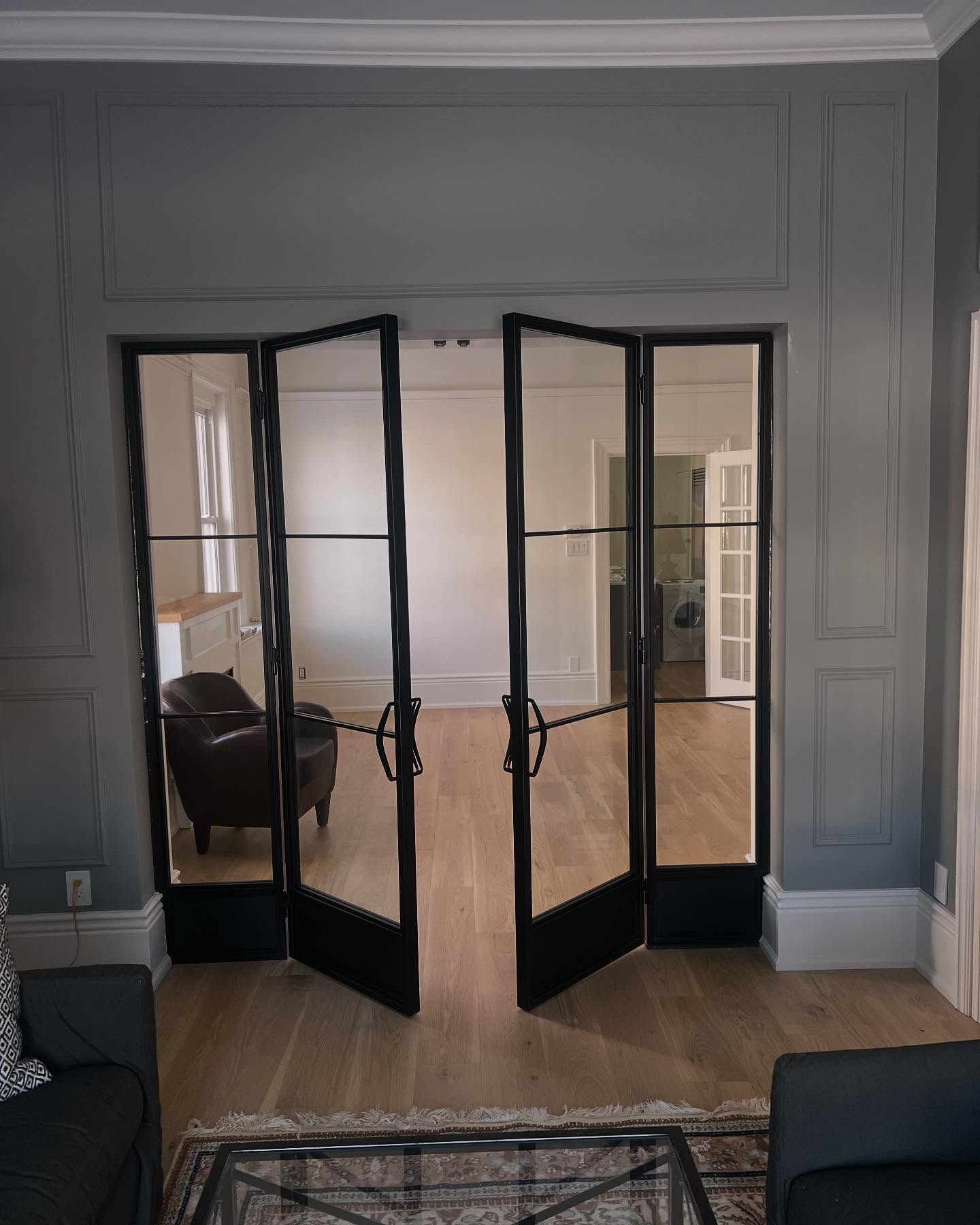 Beautiful set of doors we put in for a house in Collingwood. Custom handles, 6mm tempered glass and a small steel kick plate below.