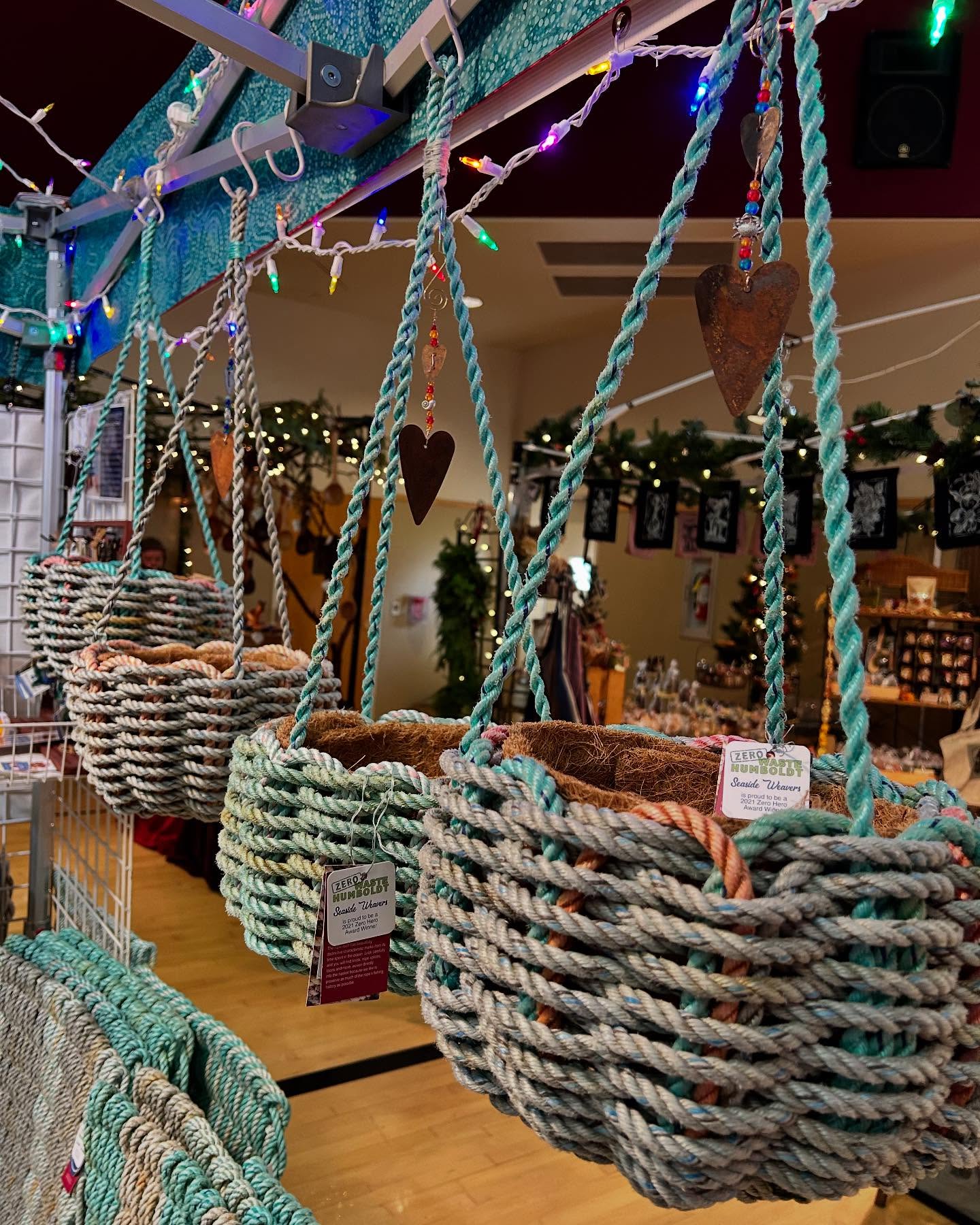 Happy Holidays SPECIAL
Today through Christmas we’re discounting our Hanging Sea Baskets to $75. (normally $85)
You can add an optional Charm for $20 or hang something special of your own from the loop at the top.
We’re at the Arcata Community Center Holiday Fair today til 4:00 or reach out to us directly.
Fun fact … in less than five years we have woven and sold 161 miles which weighs 17 tons of reclaimed ocean Rope!