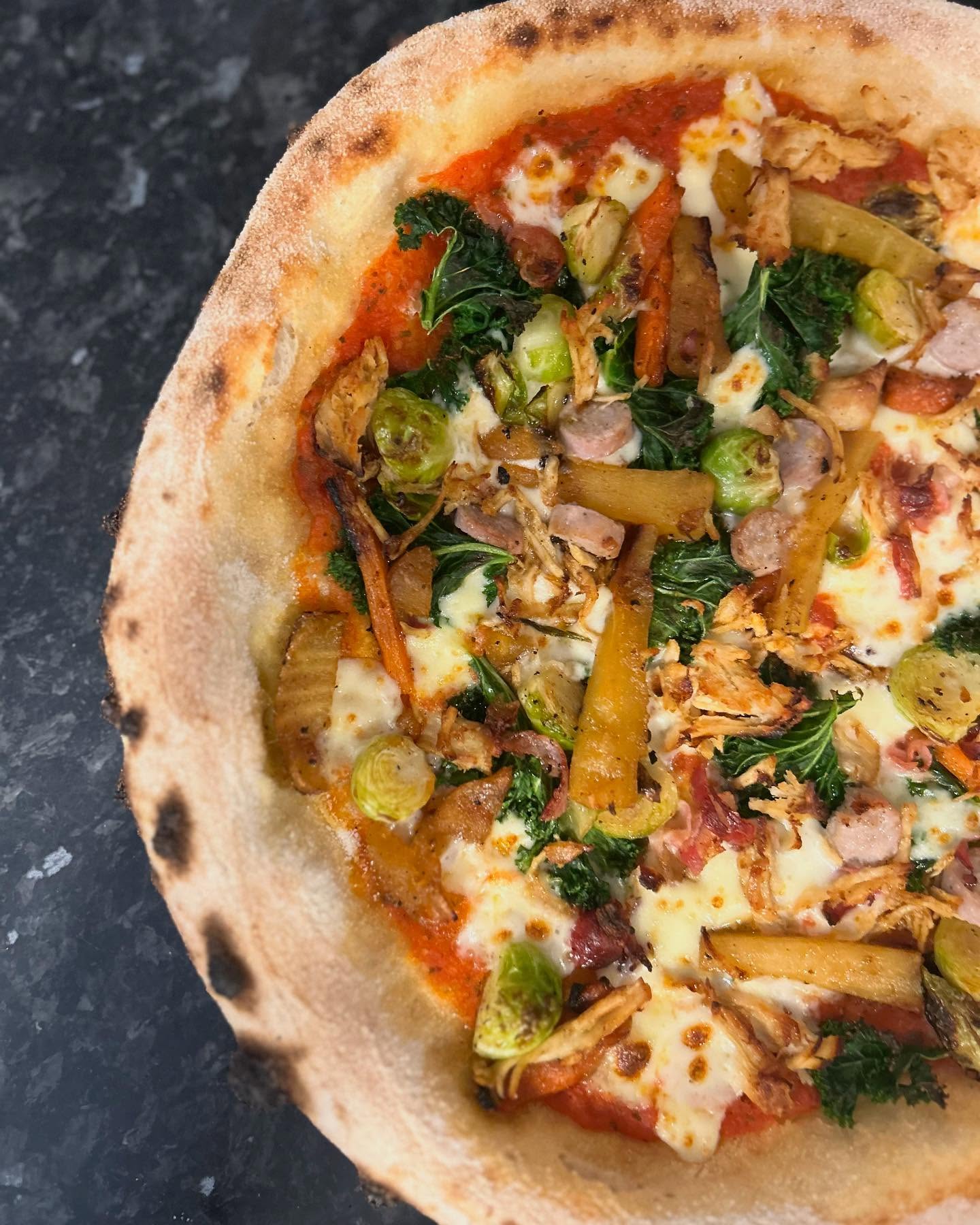 CHRISTMAS SPECIALS
LEFT OVER CHRISTMAS DINNER £17
Standard base, Tomato sauce, mozzarella, maple roasted carrots and parsnips, garlic roasted brussel sprouts, curly kale, roasted turkey, pigs in blankets, cranberry sauce drizzle
VEGGIE WONDERLAND PIZZA £16
Standard base, Tomato sauce, mozzarella, maple roasted carrots and parsnips, garlic roasted brussel sprouts, curly kale, mushroom and sage stuffing, cranberry sauce drizzle
FROSTYS VEGAN FEAST £16
Standard base, tomato sauce, vegan cheese, maple roasted carrots and parsnips, garlic roasted sprouts, curly kale, mushroom and sage stuffing, cranberry sauce drizzle
SNOWY STICKS £4.5
10 Breadsticks lightly dusted in icing sugar, with a Nutella dipping sauce.